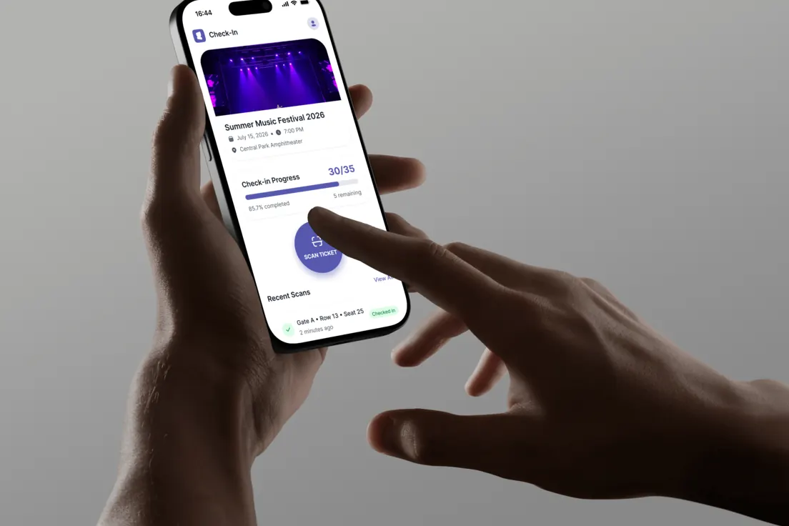 Two hands holding a phone showing the Entrello check-in screen